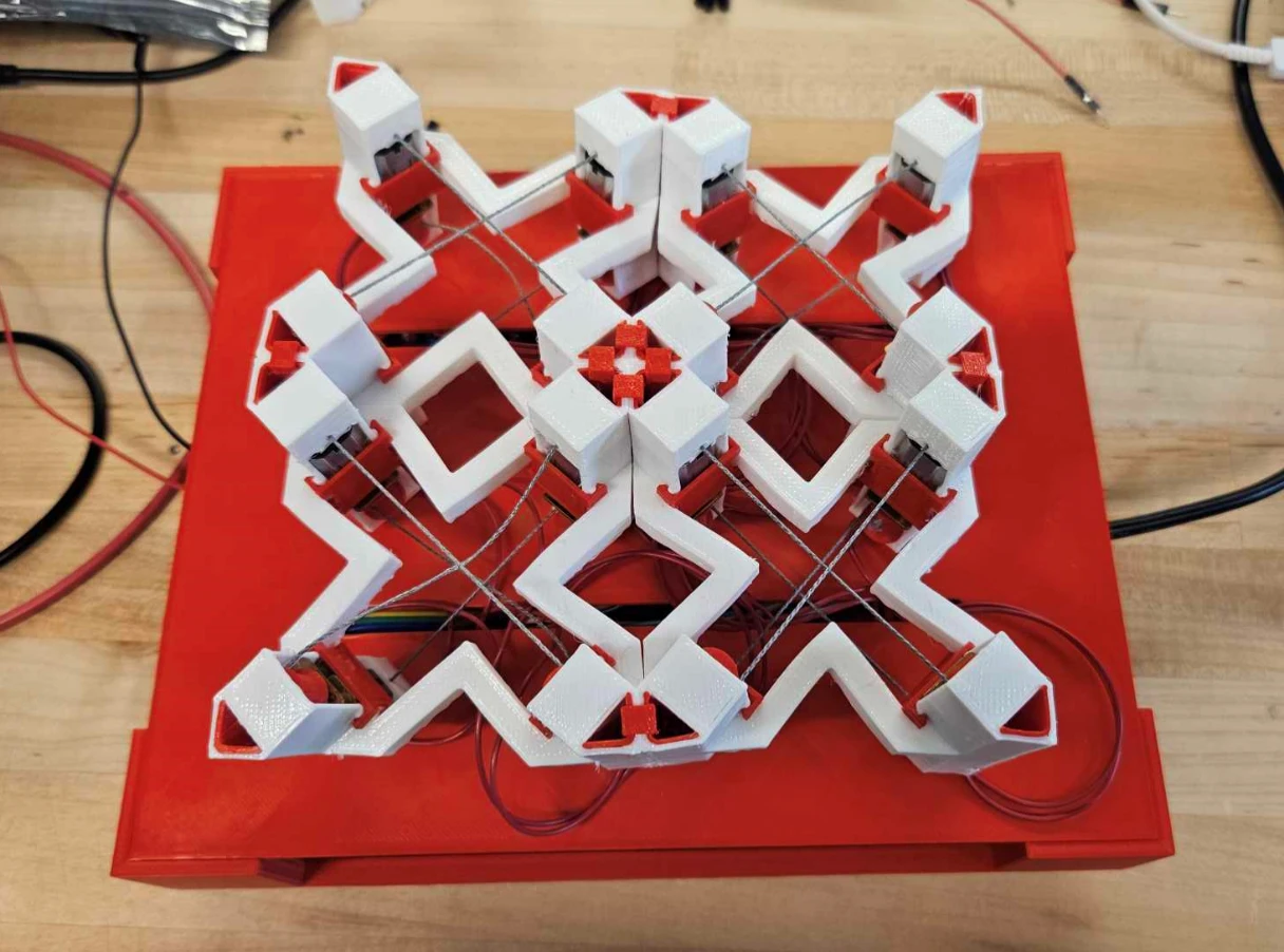 Four connected printed modules on a red base