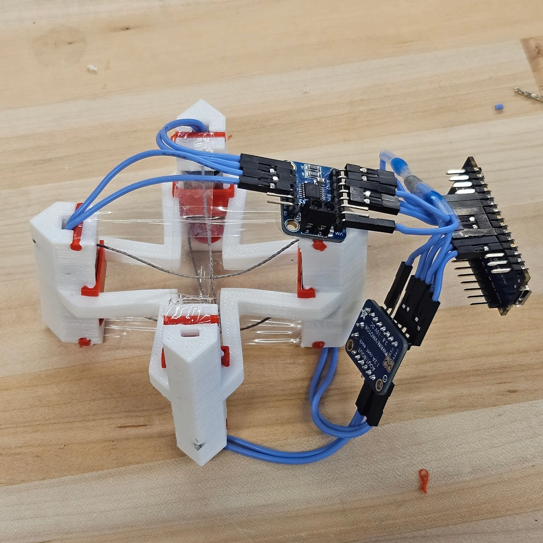 Printed cable-actuated module with attached circuit boards